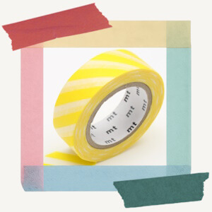 Roll of decorative paper masking tape from MT with a bright lemon-toned striped pattern